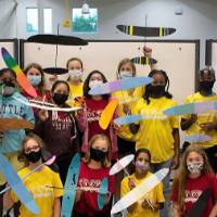 Campers show off their completed airplanes